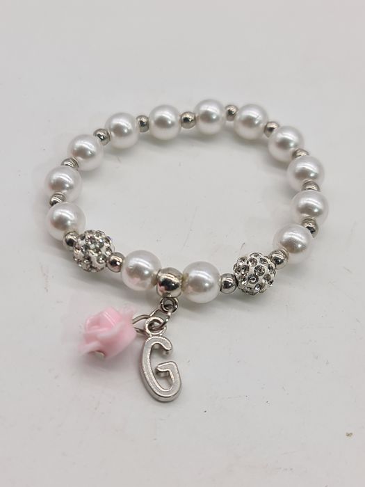 Pulseira criança com flor rosa e letra G nova