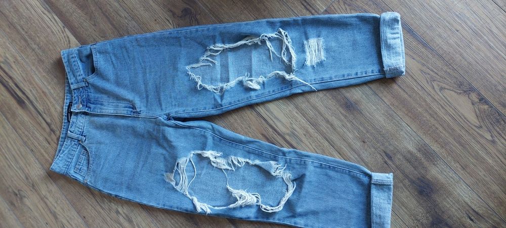 Spodnie jeansowe damskie z rozdarciami Cropp  Xs.