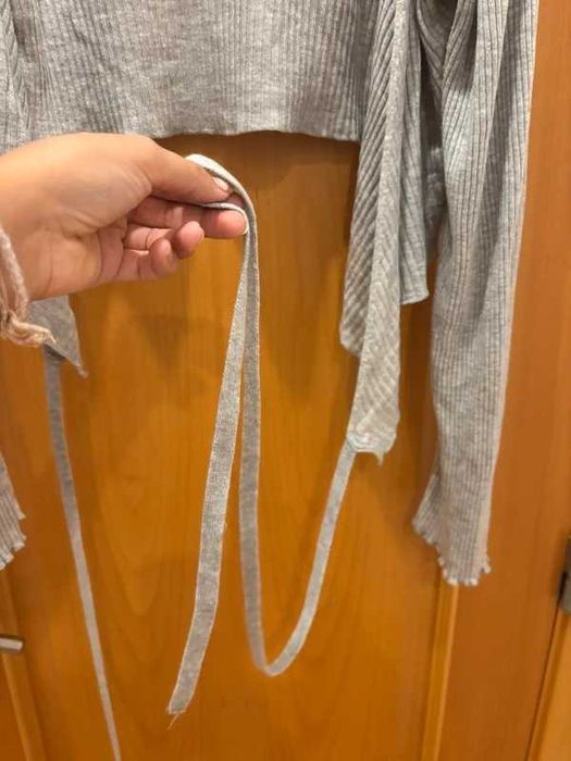 Casaco de malha cinzenta