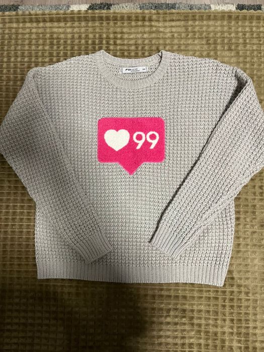 Новий сірий вязаний светер