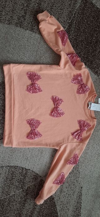 Bluza z cekinowymi kokardami rozm. Xxl