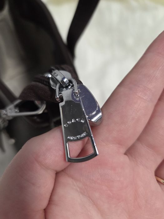 Дуже гарна новиночка, вмістка Coach  шоколад та чорна