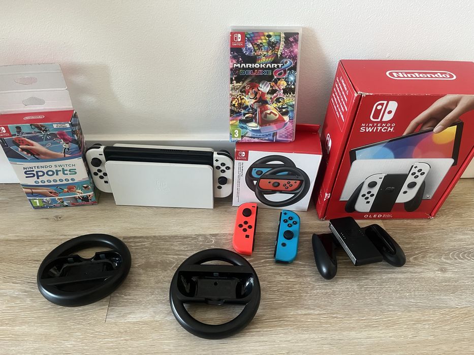 Nintendo Switch Oled + Mario Kart 8 + Sports +4 Joy Con + 2 Volantes