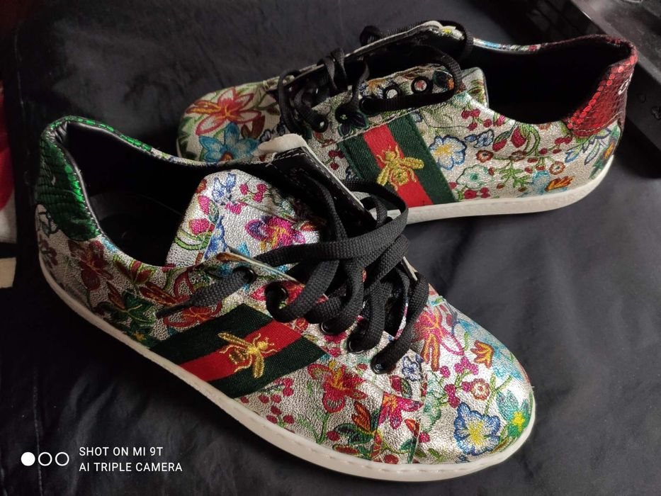 Кросівки Gucci Ace з квітковим принтом.