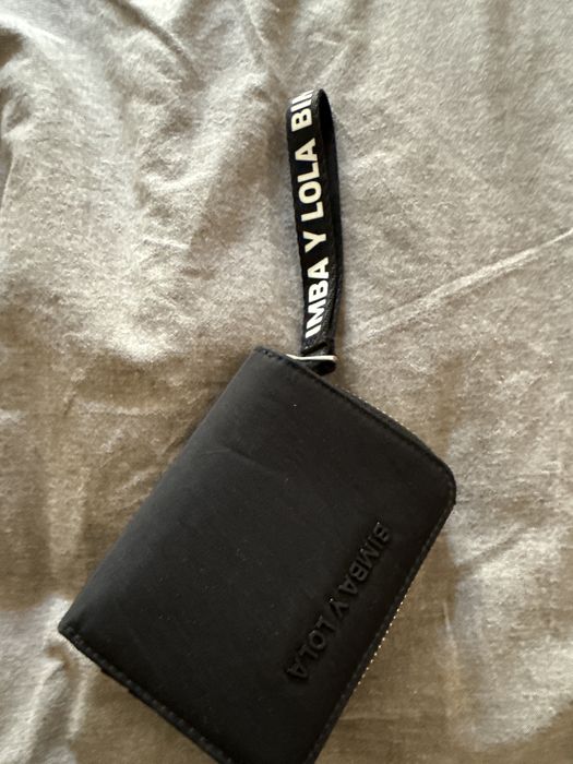 Carteira preta para cartoes notas e moedas