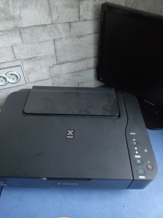 Продам сканер -принтер canon МР230мр230