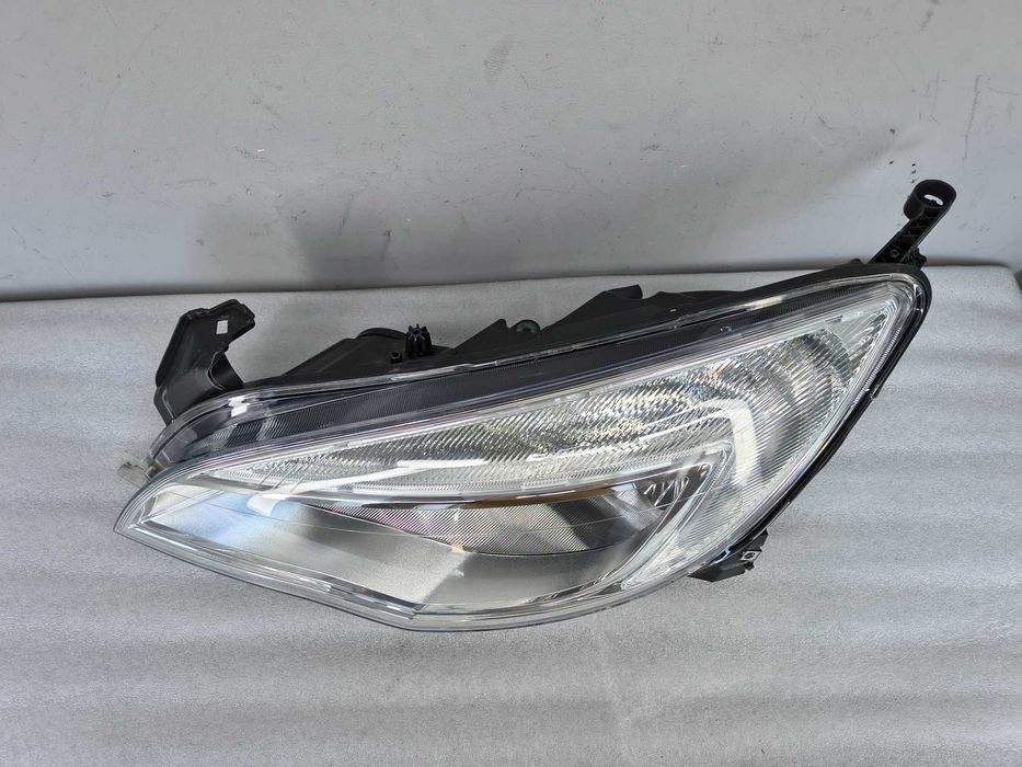 Lampa reflektor Lewy Opel Astra J IV