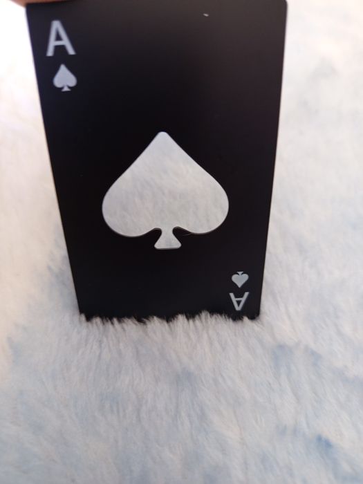 Abre cápsulas Às de paus.