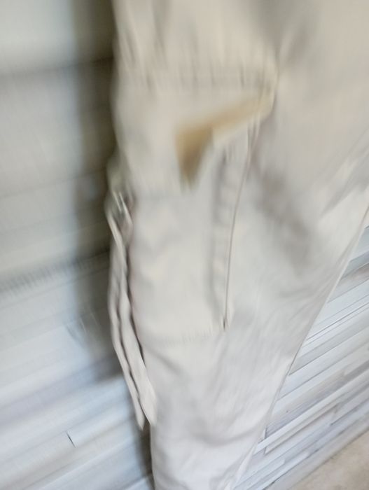 Spodnie damskie beżowe śliski materiał