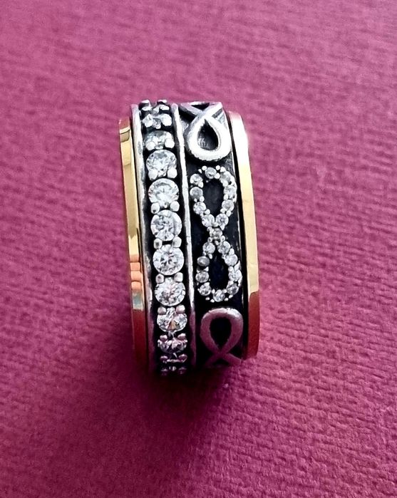 Anel bicolor, em aço, com zirconias e infinitos. Anti-stress. T17