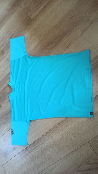 Koszulka do sportów wodnych firmy RIP Curl. Damska