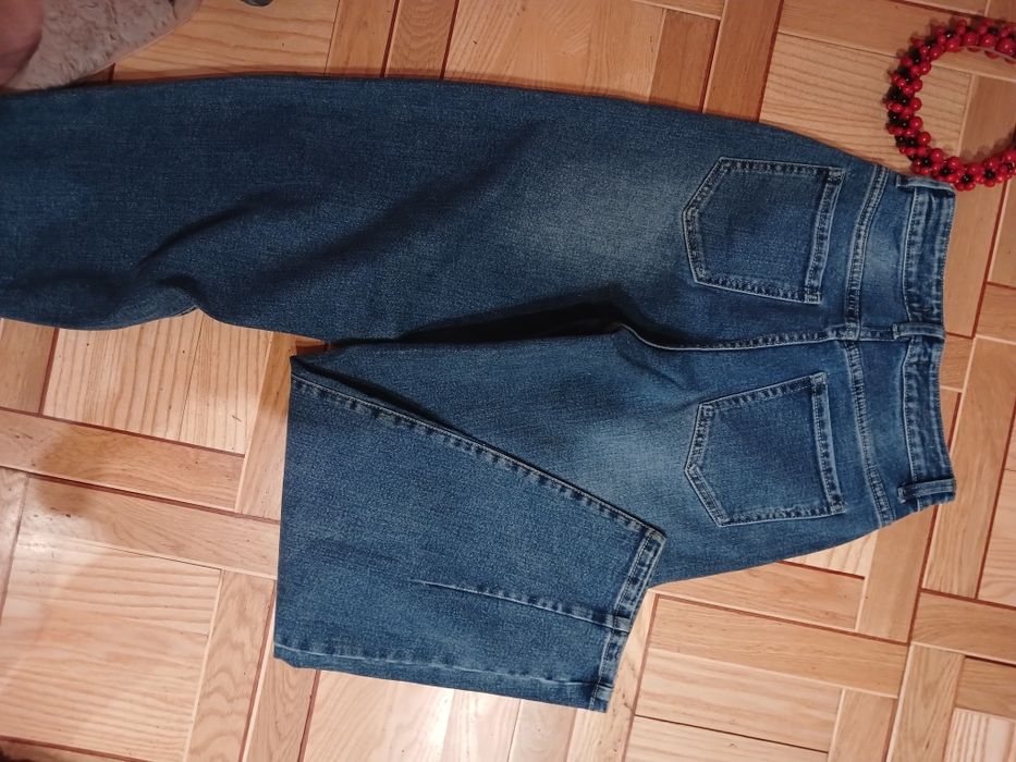 Джинси труби синього кольору