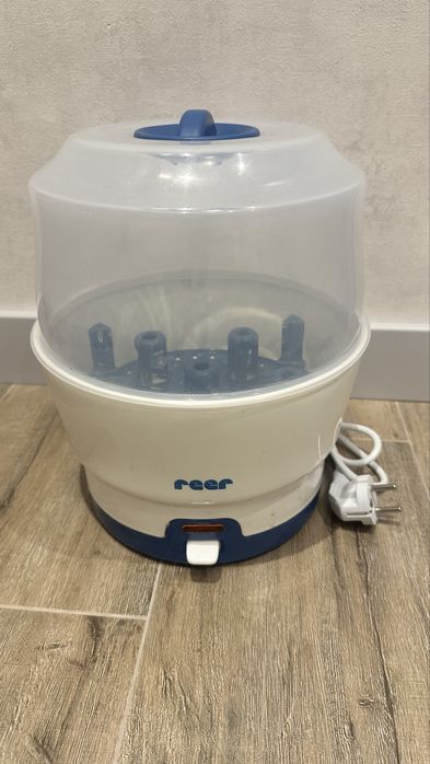 Паровой стирилизатор  бутылочек reer