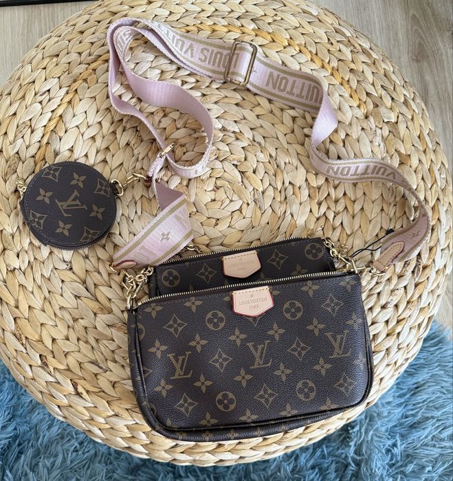 Mala Louis Vuitton com alça rosa