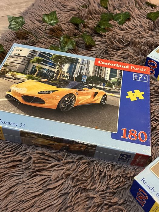 3 sztuki puzzli z autami (jedne zafoliowane,2 używane) 2x180 i 1x60 e.