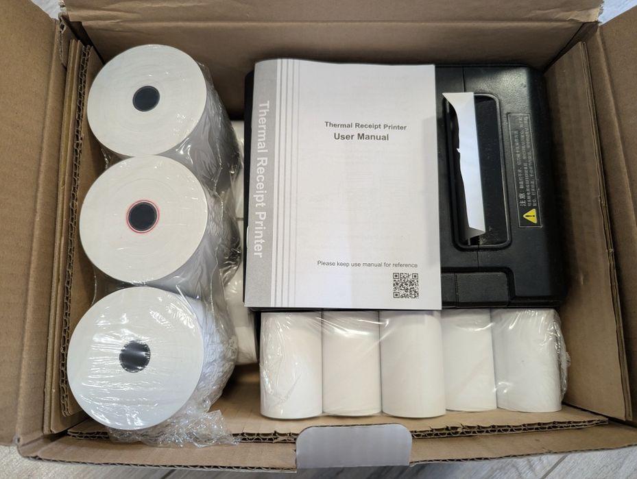 Принтер чеків Xprinter XP-Q200 та касова стрічка.