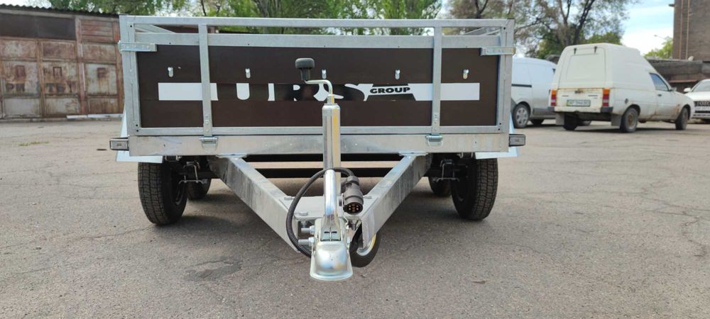 Прицеп двух осник, две оси, усиленный бортовой, оцинкованный Ursa,