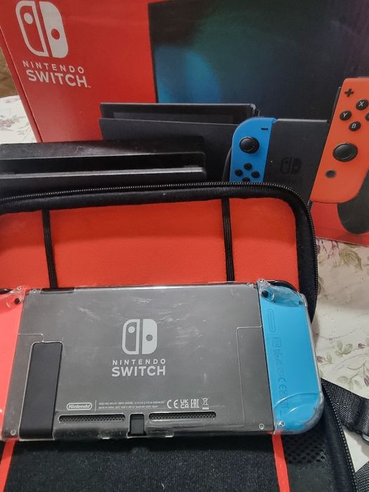 Nintendo Switch com caixa jogos e todos acessórios