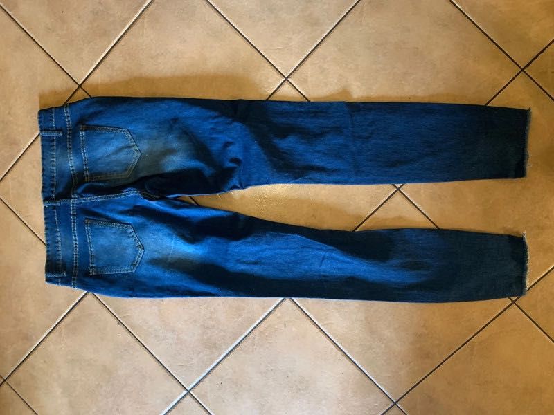 Spodnie z dziurami przecieranie jeansy granatowe damskie 40 L