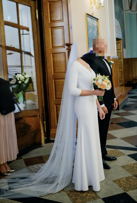 Suknia ślubna z rękawem