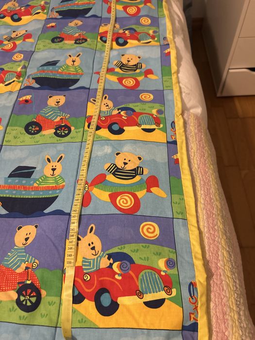 Colcha enderdon  de criança ilustrada.