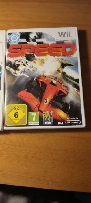 2 jogos da Wii do mickey e das corridas