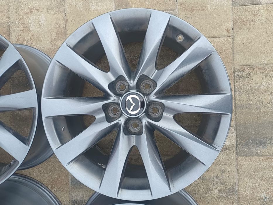 Oryginalne felgi aluminiowe Mazda, R17 5x114.3, ET 50, dekielki