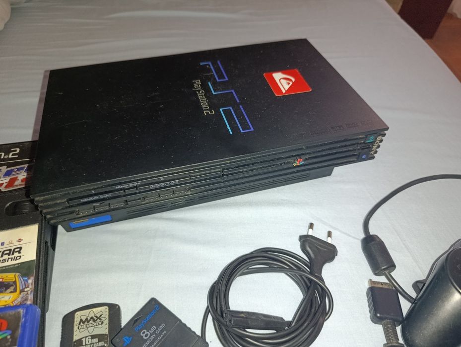 Ps2 com jogos e dois comandos originais
