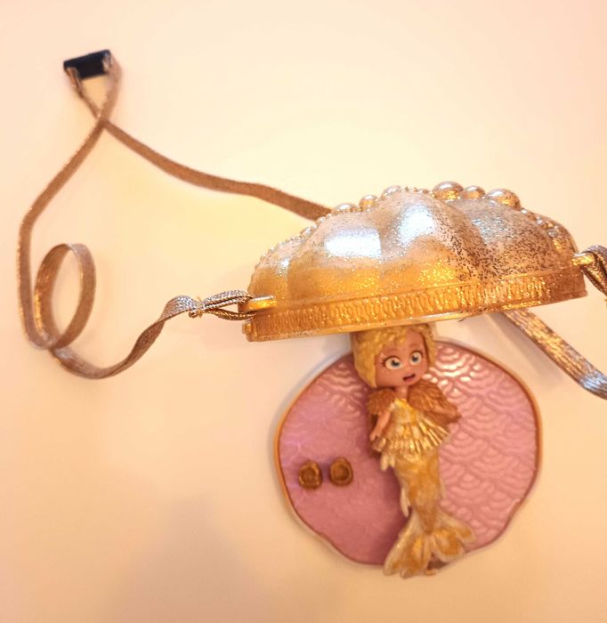 Fantastyczna syrenka  z puzderkiem dziewczynki w kształcie muszli