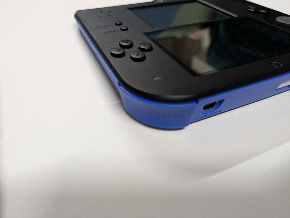 Nintendo 2DS (Super Mario Bros.2)
Super Mario Bros.2) pré instalado
Ca