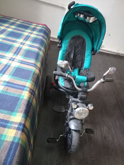 Продам отличный детский трехколесный велосипед-коляску Baby Tilly Tornado в красивом бирюзовом цвете.