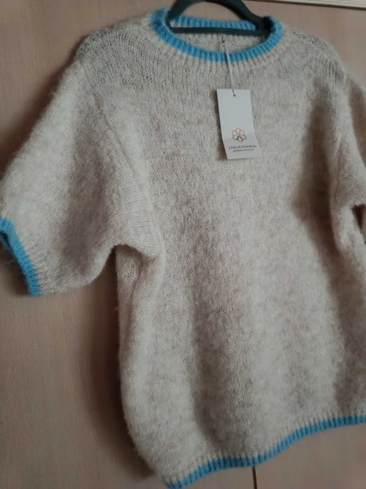 Nowy piękny  mięciutki Sweterek