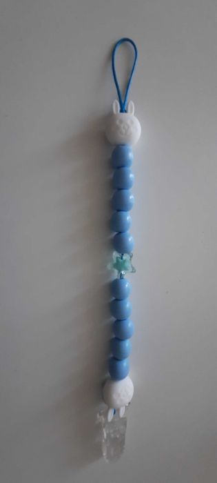 Prendedor de chupeta e lembranças de natal