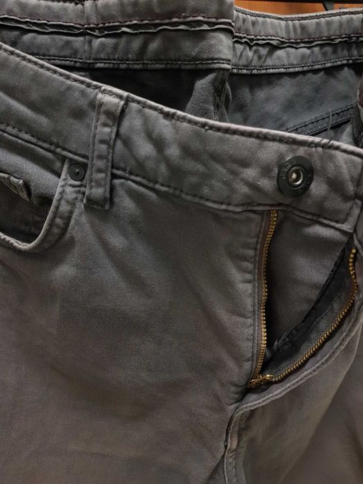 Calças homem cinzento Zara modelo similar Lee Levis Scalpers