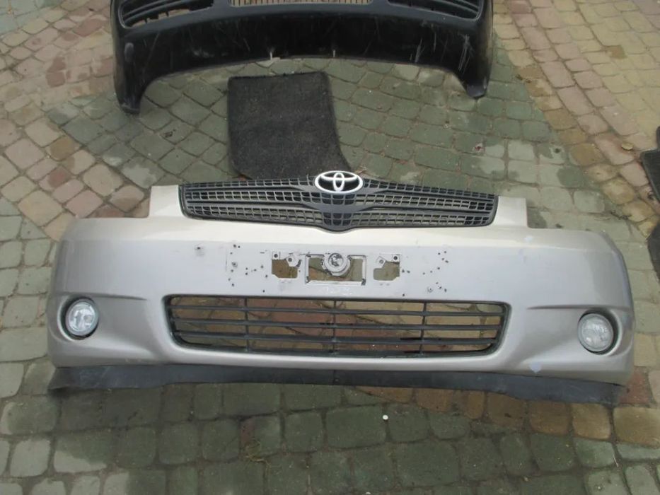 Zderzak TOYOTA COROLLA VERSO + HALOGEN, GRILL 1D9
