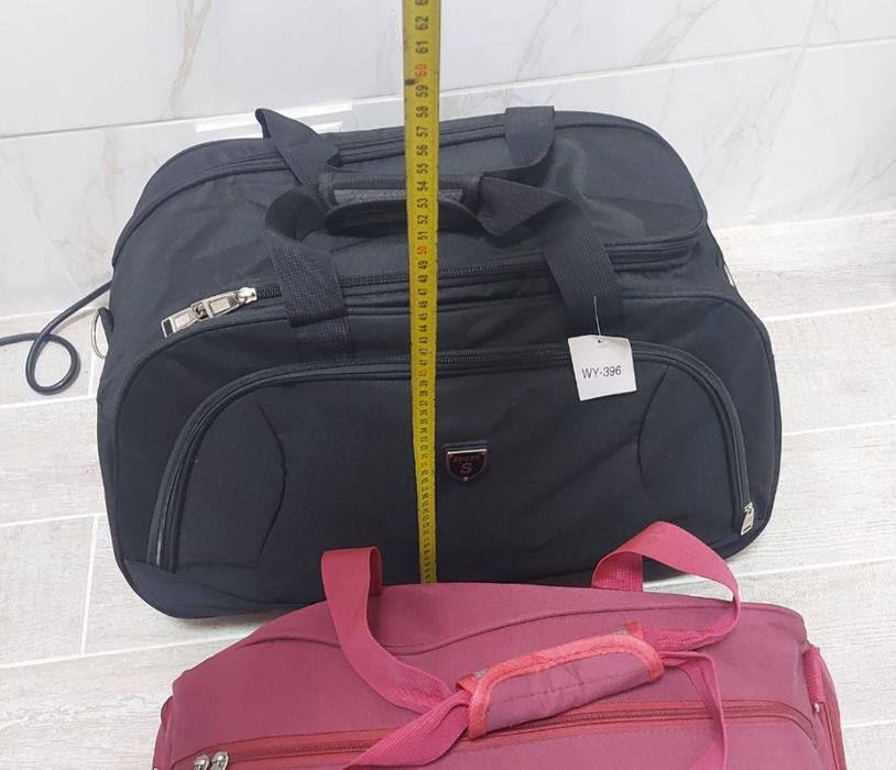 Сумки ручна та на колесах