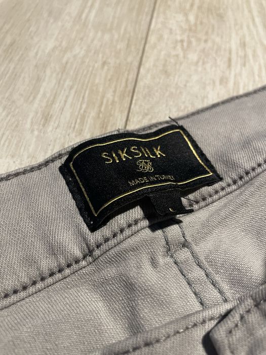Siksilk Drip y2k Jeansy z Dziurami Szare