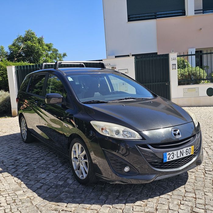 Vendo mazda 5 de 7 lugares está extremamente impecável