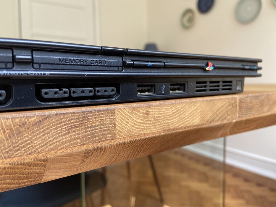 Selling PS2 Slim with vertical stand, 2 controllers, and 7 games64409139350786122