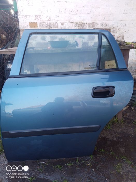 Двері Опель Астра G