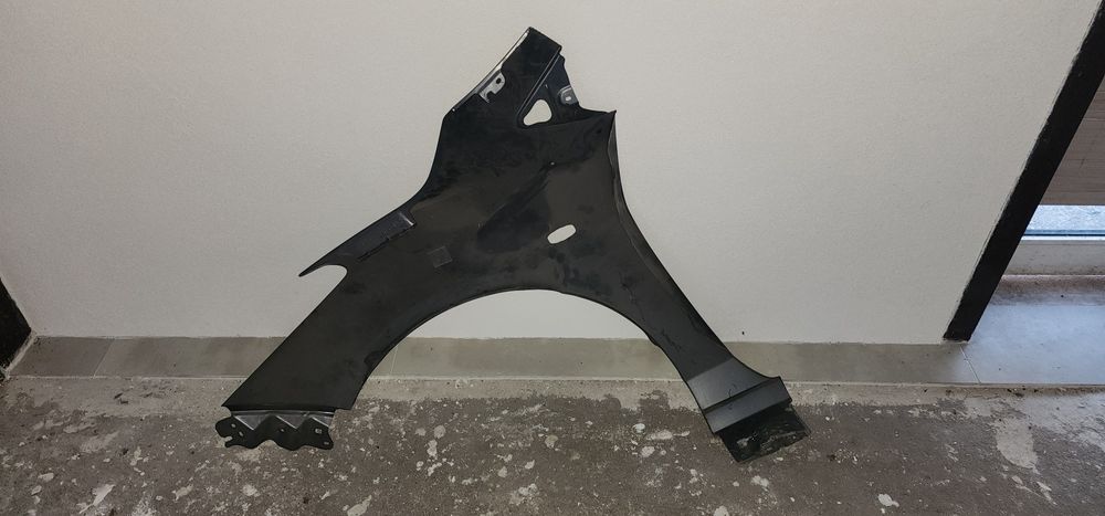 Guarda lamas mazda 2 2008