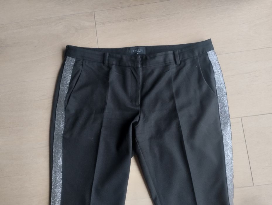 Mohito eleganckie czarne spodnie ze srebrnymi lampasami r. 42 L