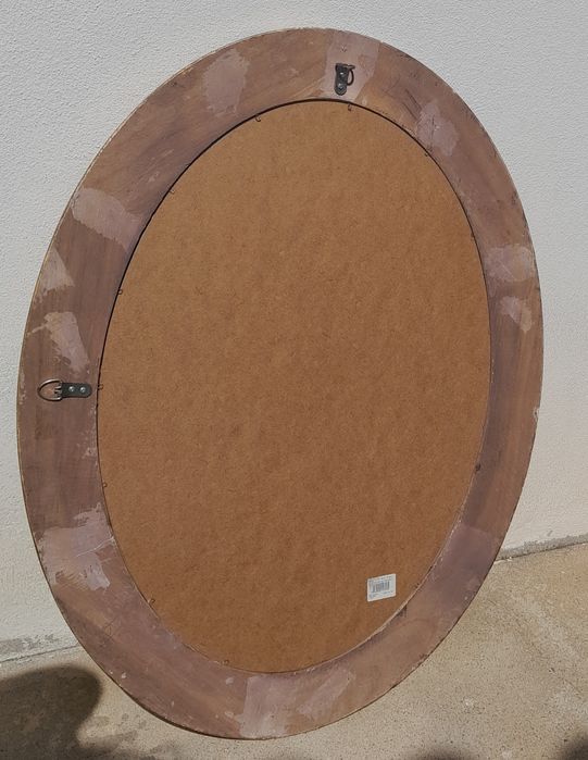 Espelho dourado oval