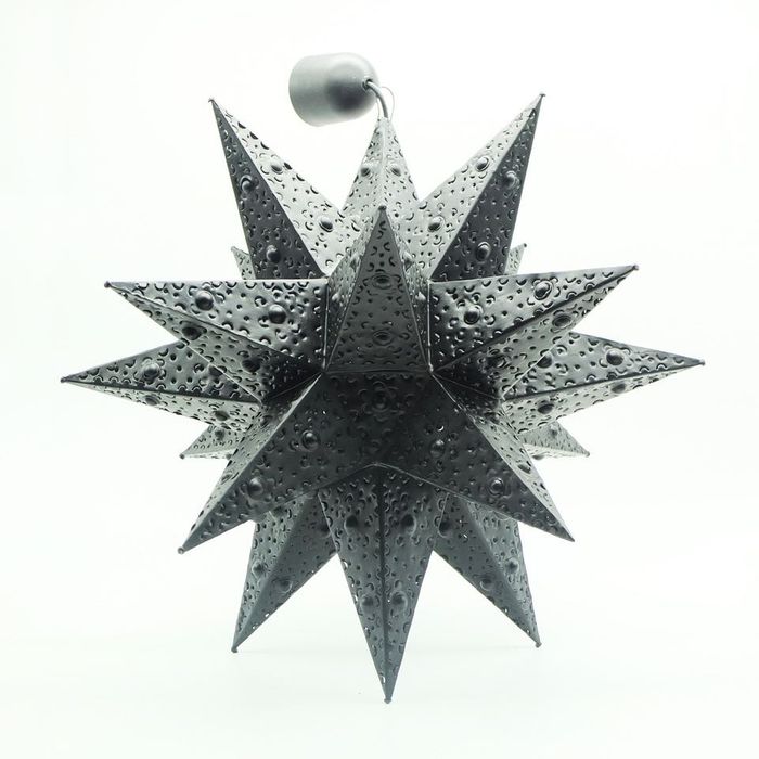 Black metal star-shaped perforated lamp