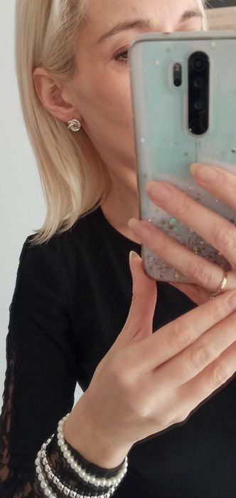 Przeplatane kolczyki kolor srebrny