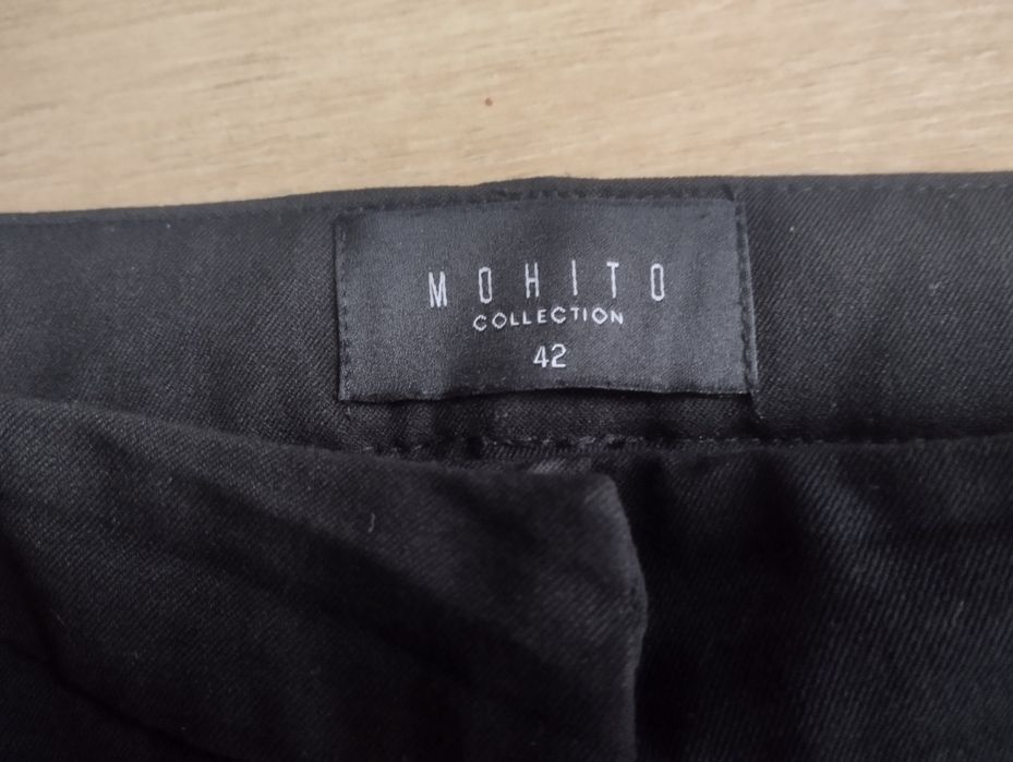 Mohito eleganckie czarne spodnie ze srebrnymi lampasami r. 42 L