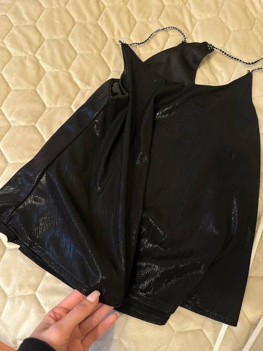 Майка на брителях