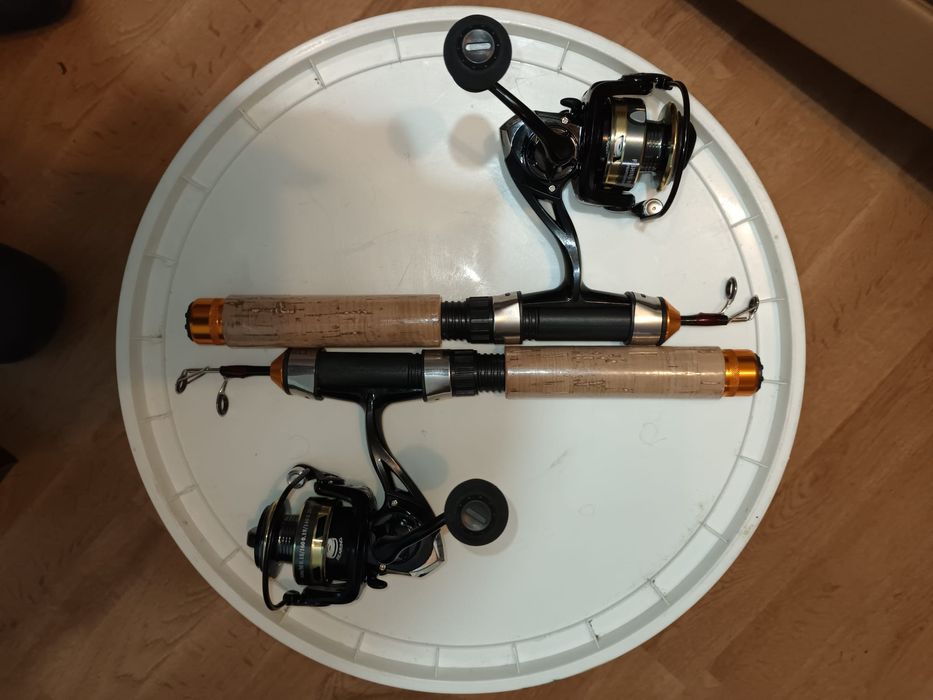 Ksiazka isaac singer i 2 wędki podlodowe z kolowrotkami