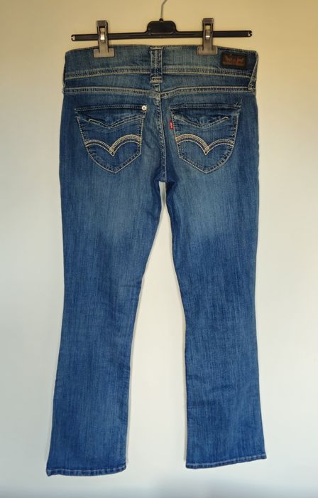 Levi's jeansy bootcut biodrówki przetarcia z USA