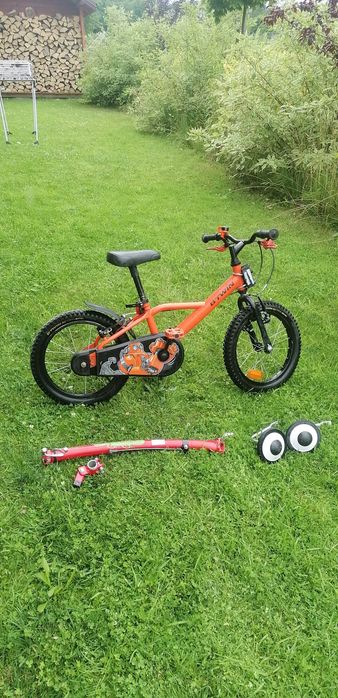 Rower Btwin pomarańczowy, hol rowerowy trail gator, kółka